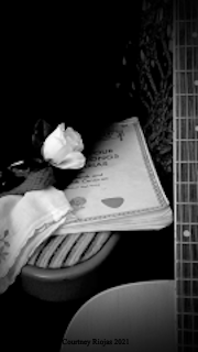 A beautiful guitar and sheet music.